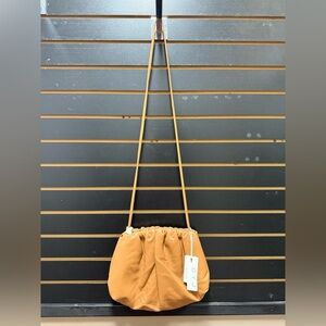 New with tags tan cloud soft pouch pleated cross body purse
